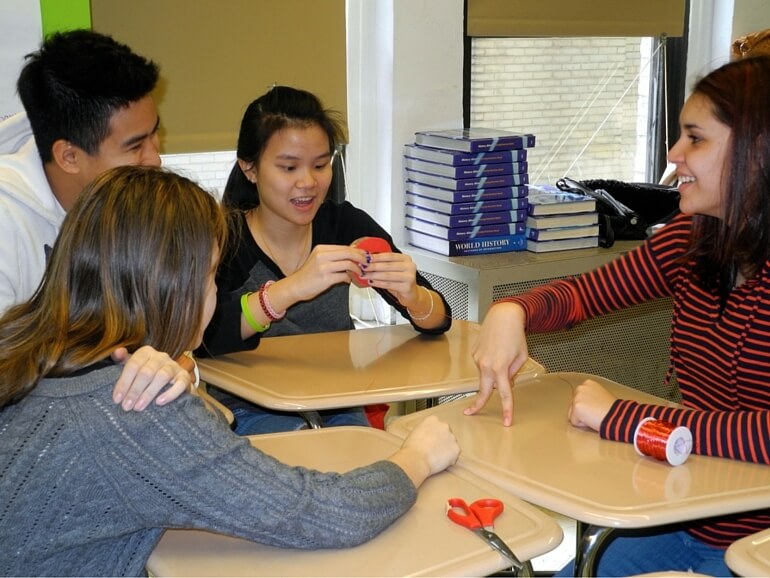 group of students discussing how to make a DIY generator